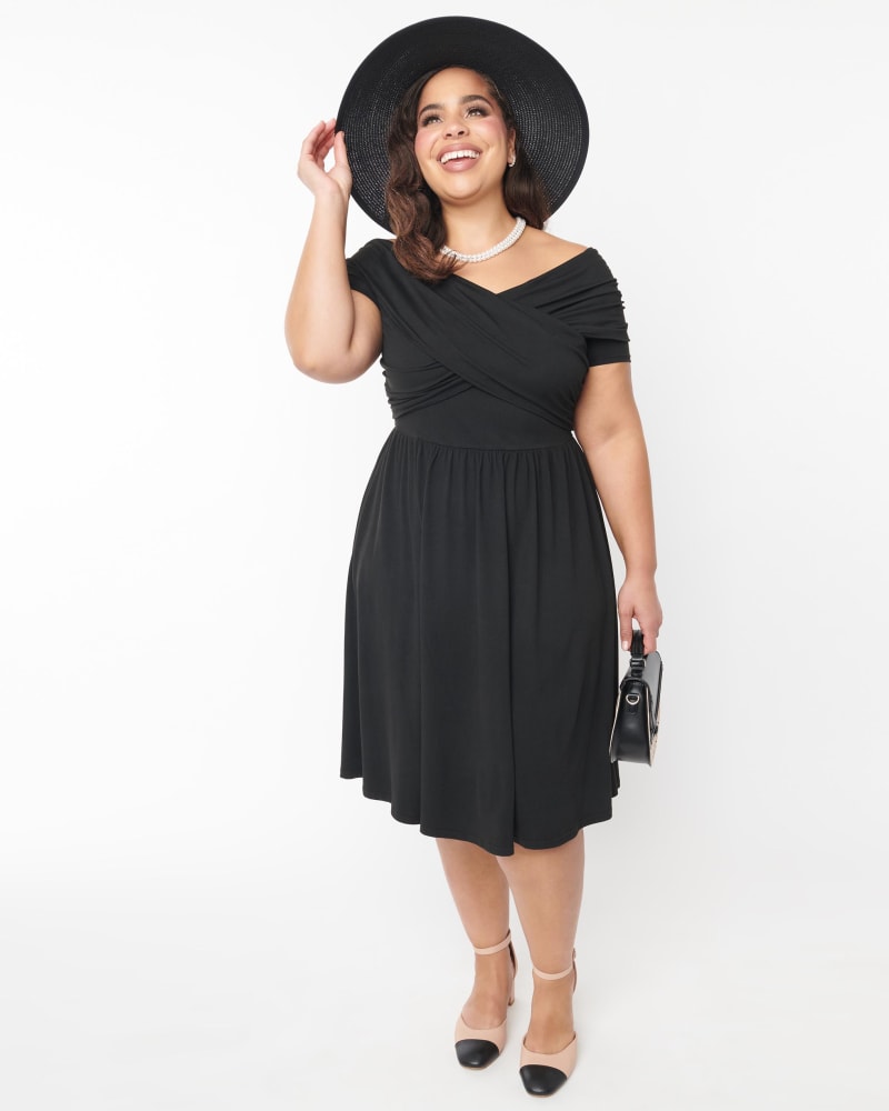 Front of a model wearing a size 2X Unique Vintage Black Shirred Swing Dress in Black by Unique Vintage. | dia_product_style_image_id:340640